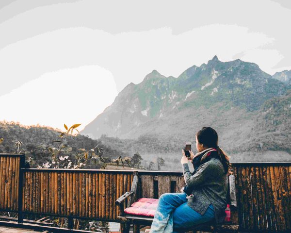 compressed_young-woman-taking-photo-with-her-phone-beautiful-mountain-view (1)